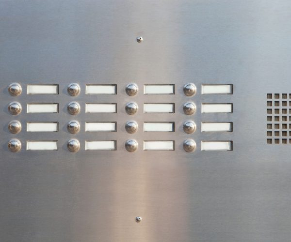 A panel of doorbells